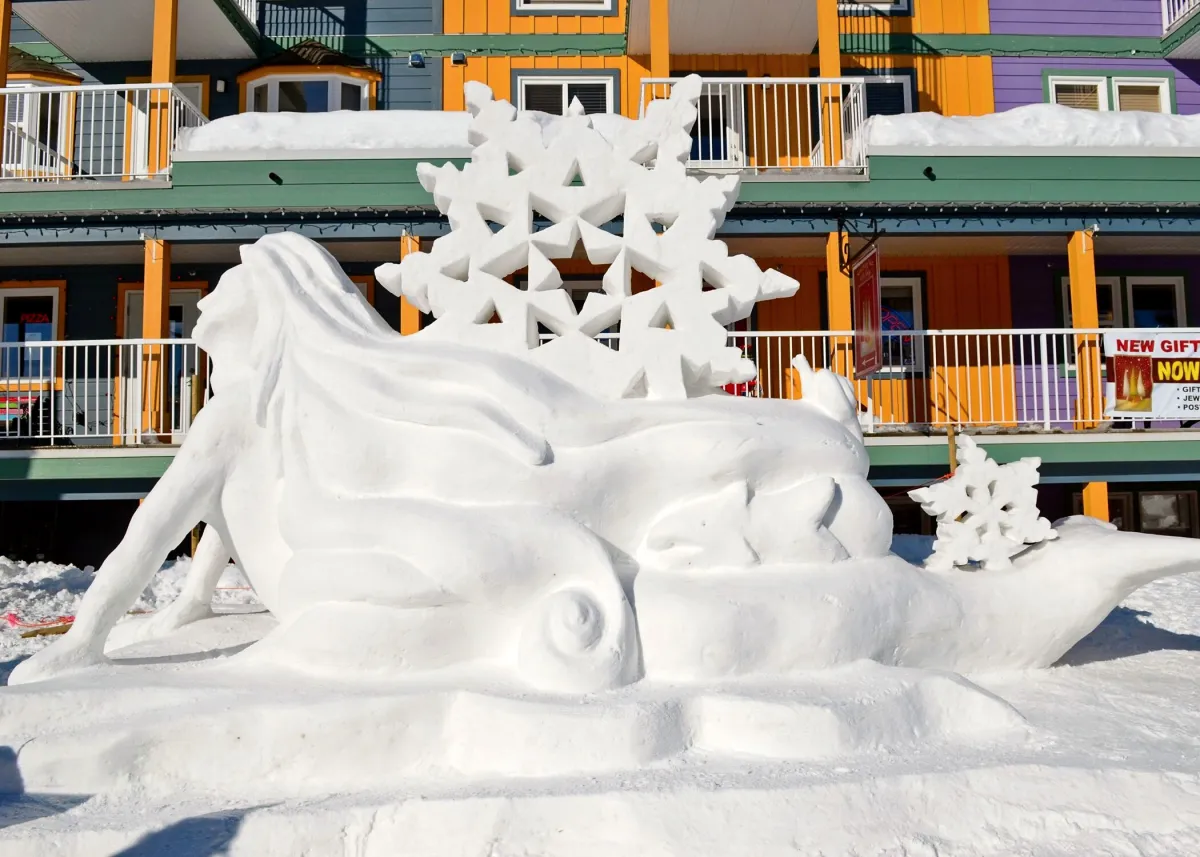 A snow sculpture of a mermaid at Silverstar Mountain Resort