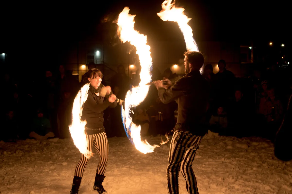 Two fire spinners performing at the Vernon Winter Carnival